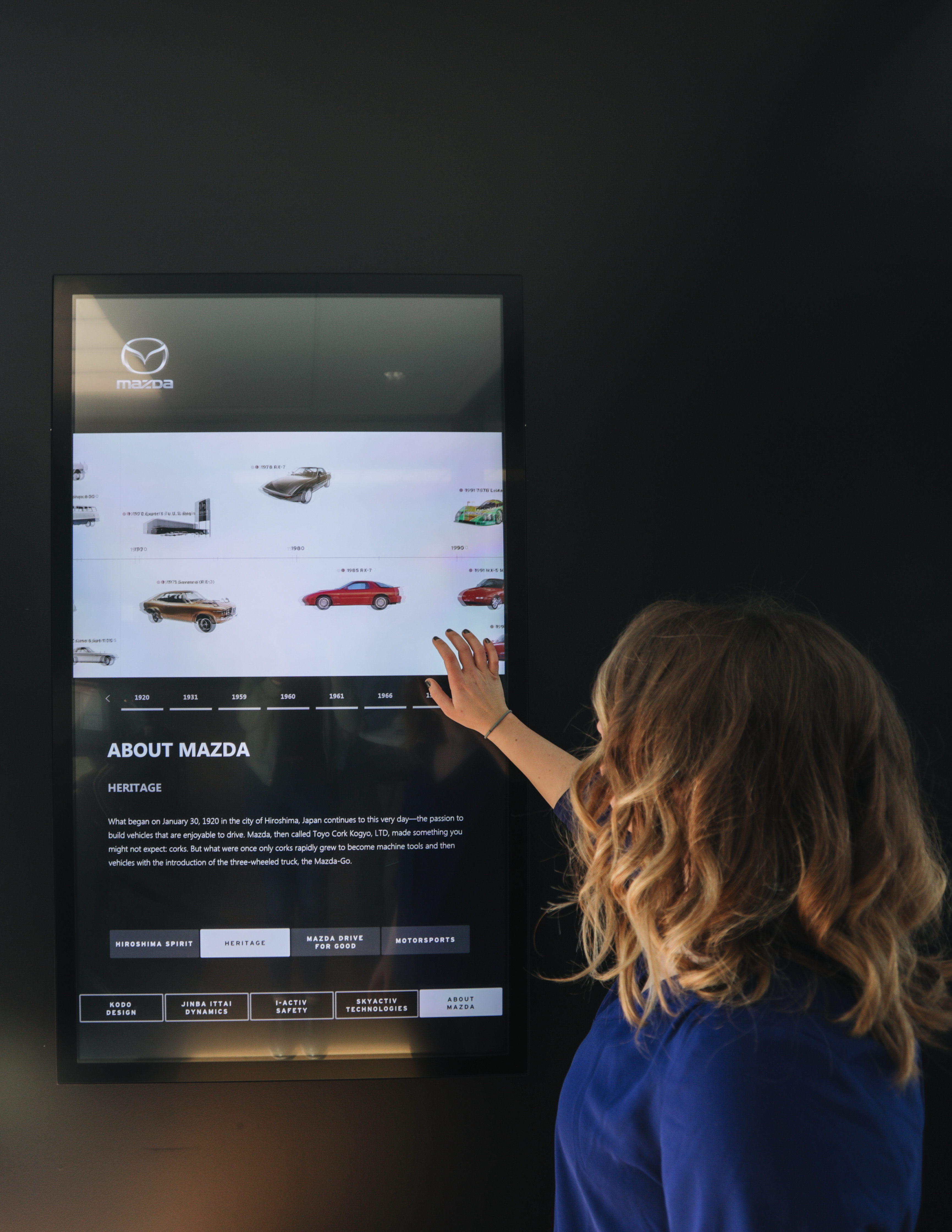 Mazda interactive touchscreen experience installed in a dealership showroom